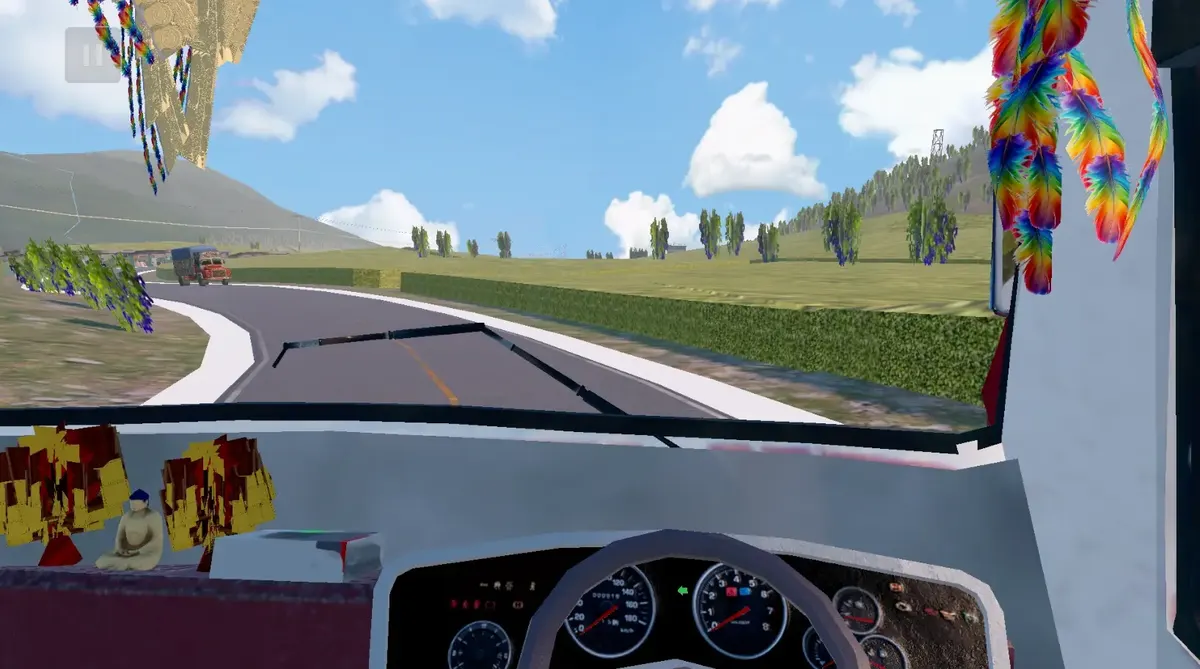 Driver's view from the bus cabin, with prayer flags at the window