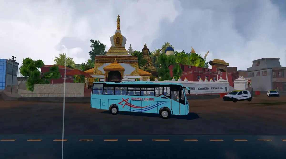 A coach passes a white stupa