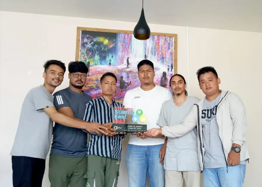 The team holding their Start-Up Fest award